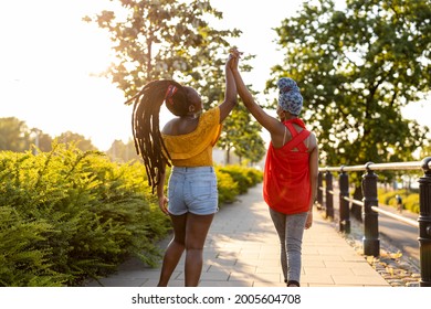 Two Girlfriends Having Fun Outdoors
