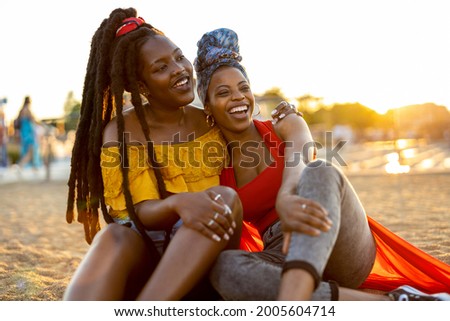 Two girlfriends having fun outdoors
