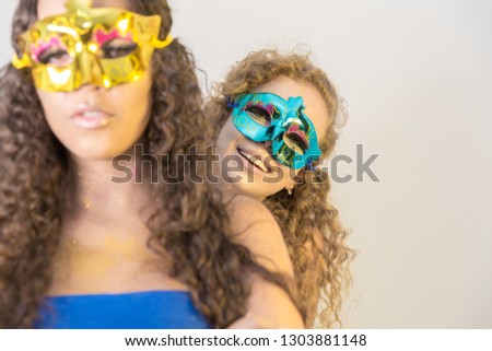 two girlfriends with masks smiling concept carnival