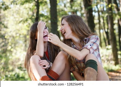 Two Girlfriends Outdoor Laughing