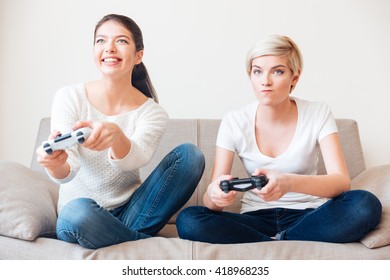 Two Girlfriends Playing Video Games 