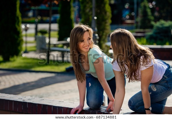 two girlfriends play