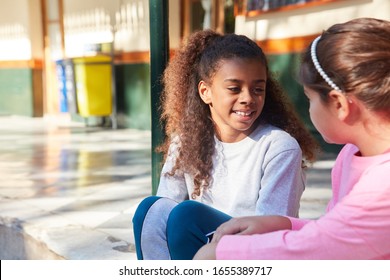 Two girls as best friends talk to each other in summer camp