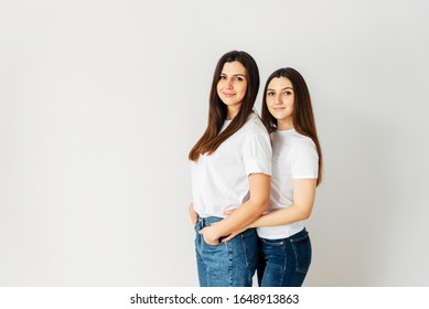 Two girls in casual outfits in the studio. - Shutterstock ID 1648913863