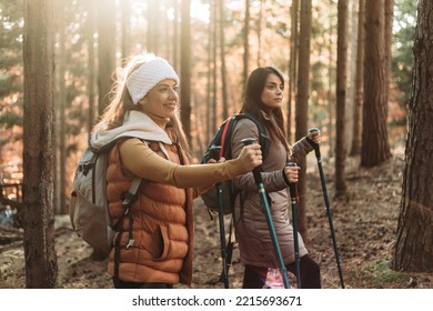 Two Girls Climbing Up The Hill Together. Autumn Colors