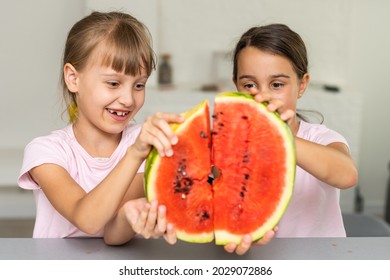 Two Girls Eating Watermelon Isolated At Home