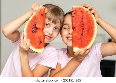 Two Girls Eating Watermelon Isolated At Home