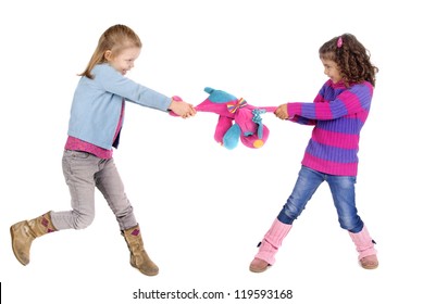 two girls fighting over a toy