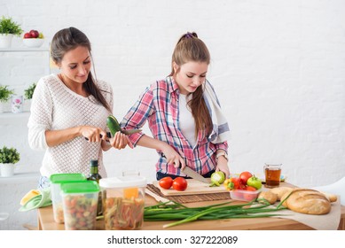 Two Girls Friends Preparing Dinner In A Kitchen Concept Cooking, Culinary, Healthy Lifestyle