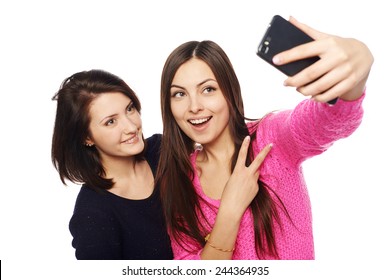 Two Girls Friends Taking Selfie With Smartphone, Isolated On White Background