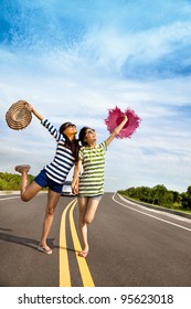 Two Girls Having Fun On The Road Trip At Summertime