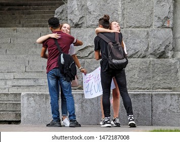 Two Girls Hold A Poster 