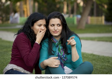 Two Girls Looking Something Park Gossiping Stock Photo 137089574 ...
