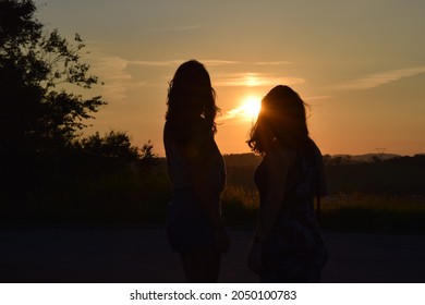 Two Girls Looking At The Sunset