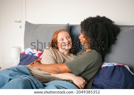 Two girls lying on the bed
