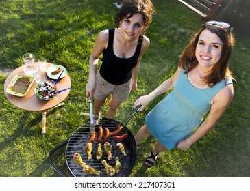 Two girls on grill  