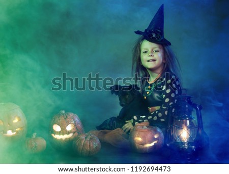 Two girls on Halloween dressed witches