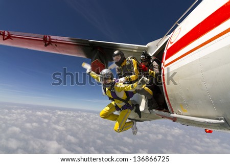 Two girls parachutist jumping out of an airplane. Foto stock © 