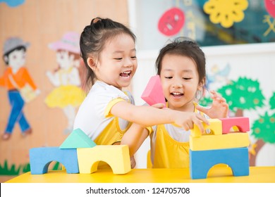 Two Girls Playing In The Studio