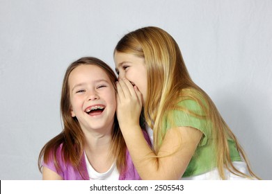 Two Girls Sharing Secret Joke Stock Photo (Edit Now) 