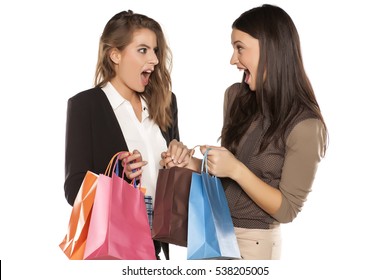 Two Girls With Shopng Bags Brag To Each Other
