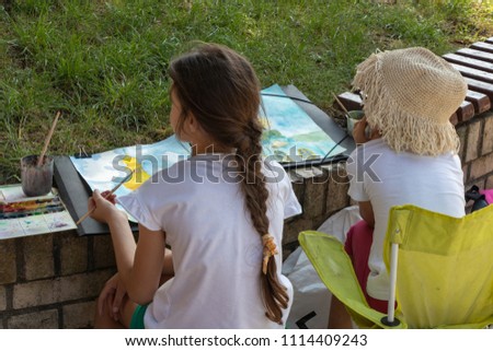 Similar – grandma reading a book to a child