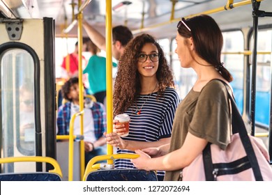 Two Girls Standing Bus Chatting Drinking Stock Photo (Edit Now) 1272072694