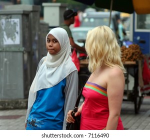 Two Girls Wearing Different Style Clothes