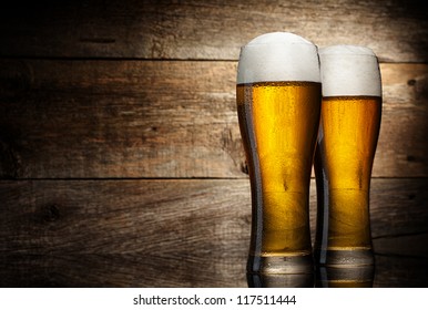 Two Glass Beer On Wood Background With Copyspace