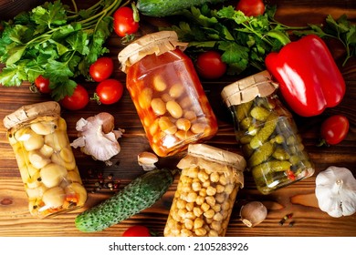 Two Glass Jars With Canned Vegetables, Lecho. Homemade Canned Food On Burlap. Canning And Storage Of Products In The Cellar. Jars Of Food Close-up.