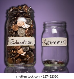 Two Glass Jars With Coins Labeled Education And Retirement Over Purple Background