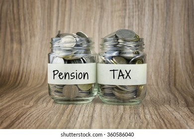 Two Glass Jars With Coins Labeled Pension And TAX. Financial Conceptual