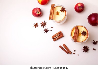 Two Glasses With Apple Cider And Apples On A White Background. Flat Lay Style