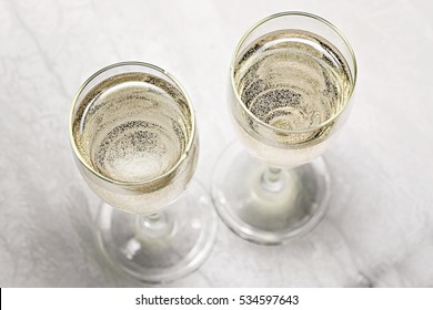 Two Glasses Of Champagne In A Close-up Top View.