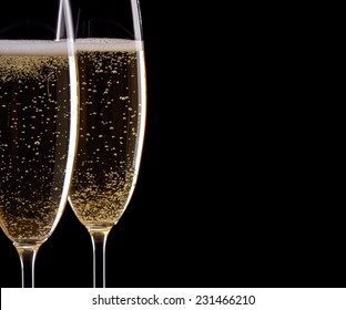 Two Glasses Of Champagne On Black Background