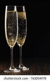 Two Glasses Of Champagne Over Black Background