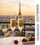 two glasses of champagne at rooftop restaurant with view of Eiffel Tower and Paris skyline, luxury romantic dinner for couple