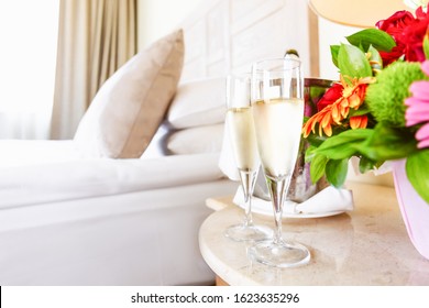 Two Glasses Of Champagne In The Upscale Hotel Room. Dating, Romance, Honeymoon, Valentine, Getaway Concepts. Horizontal