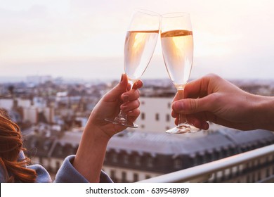 two glasses of champagne or wine, couple dating concept, romantic celebration of engagement or anniversary - Powered by Shutterstock