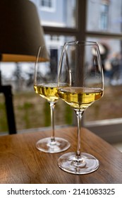 Two Glasses Of Chilean Chardonnay Viognier White Wine Served In Cosy Dutch Restaurant Close Up