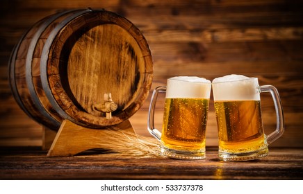 Two glasses of lager with old wooden keg, copyspace for text - Powered by Shutterstock