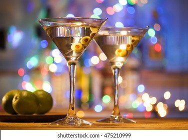 Two glasses of martini cocktail in a bar