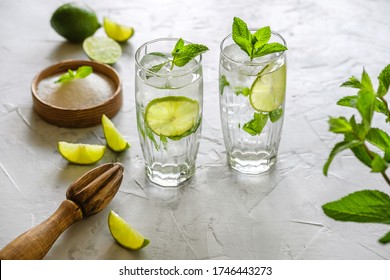 Two Glasses Of Mojito. Making Mojito Cocktail At Home. 
