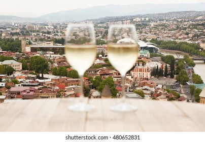 Two Glasses On White Wine On The Table In Tbilisi, Georgia.