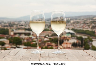 Two Glasses On White Wine On The Table In Tbilisi, Georgia.