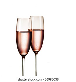 Two Glasses Of Pink Champagne, Isolated On White Background