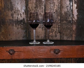 Two Glasses Of Red Wine In The Barrel Room