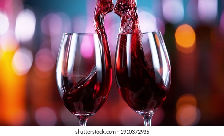 Two glasses of red wine hitting each other, blur bottles with bar counter on background - Powered by Shutterstock