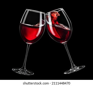 Two Glasses Of Red Wine Toasting Isolated On Black Background