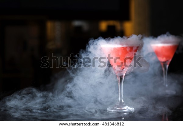 Two glasses with\
smoke from liquid nitrogen